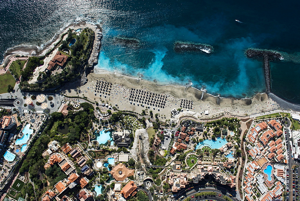 Seaside resort with beach and promenade by the sea, Playa del Duque, townscape with hotels and shopping malls, tourist area, south coast, Costa Adeje, Tenerife, Spain, Europe