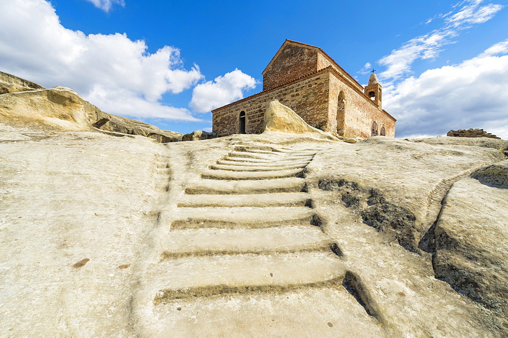 Stairs leading to 10th century Christian Prince's basilica, Uplistsikhe cave city known as Lord's fortress, Gori, Shida Kartli district, Georgia, Asia