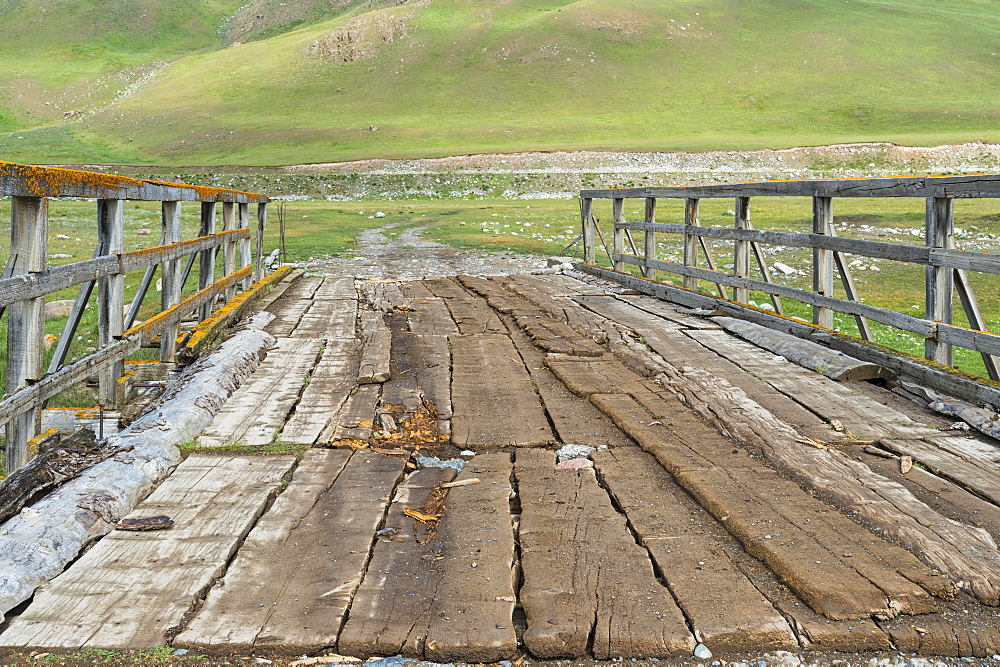 Old wooden bridge over a Mountain river, Naryn gorge, Naryn Region, Kyrgyzstan, Asia