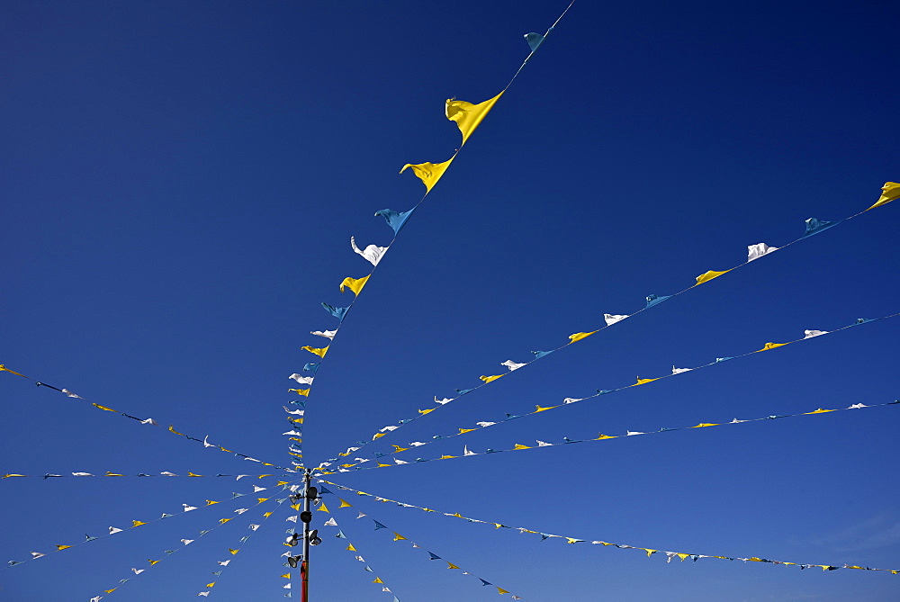 Colorful pennant against a blue sky at a festival, Candelaria, Tenerife, Canary Islands, Spain, Europe