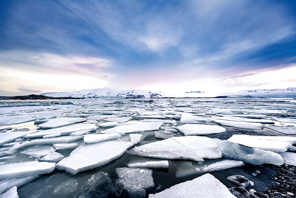 Ice floes, glacier Jokulsarlon lagoon, glacier lake, sunset, southern edge of Vatnajokull, southeast Iceland