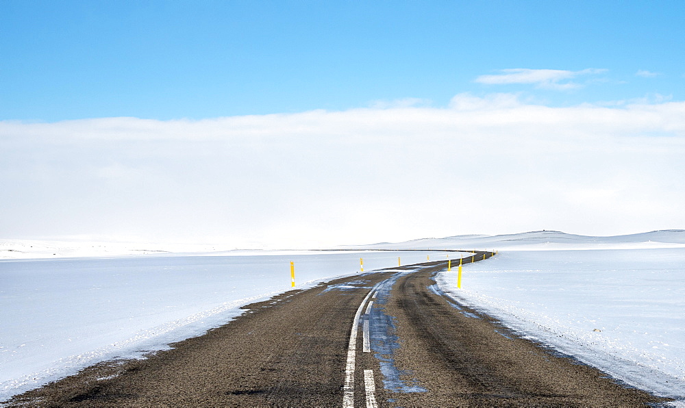 Road through snowy landscape, Route 1 between Eglstadir and Myvatn, Norourland eystra, Northern Iceland, Iceland, Europe