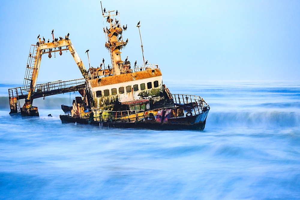 Shipwreck Zeila in the water with swell, Henties Bay, Erongo region, Namibia, Africa