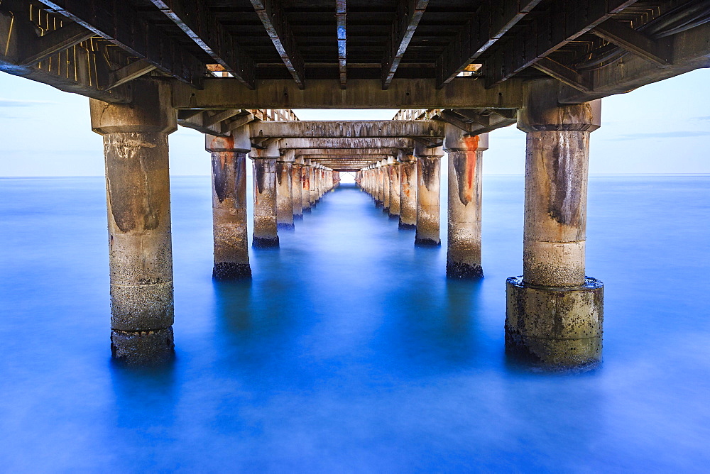 Pier from below, long time exposure, Swakopmund, Erongo region, Namibia, Africa