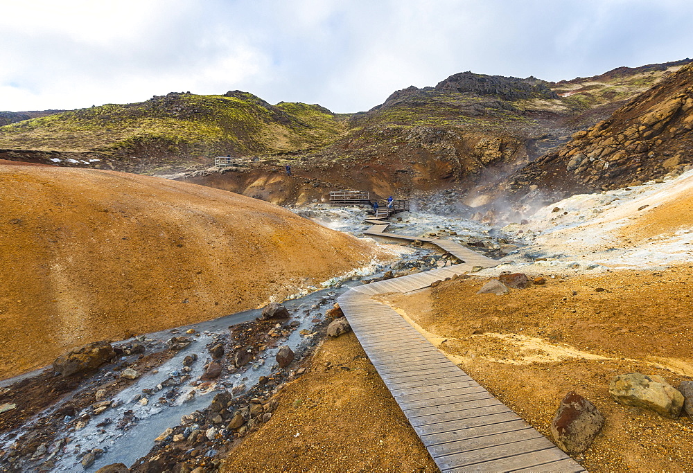 Boardwalk over steaming ground, mineral deposits, Seltun geothermal area, Krysuvik volcanic system, Reykjanesfolkvangur conservation area, Iceland, Europe