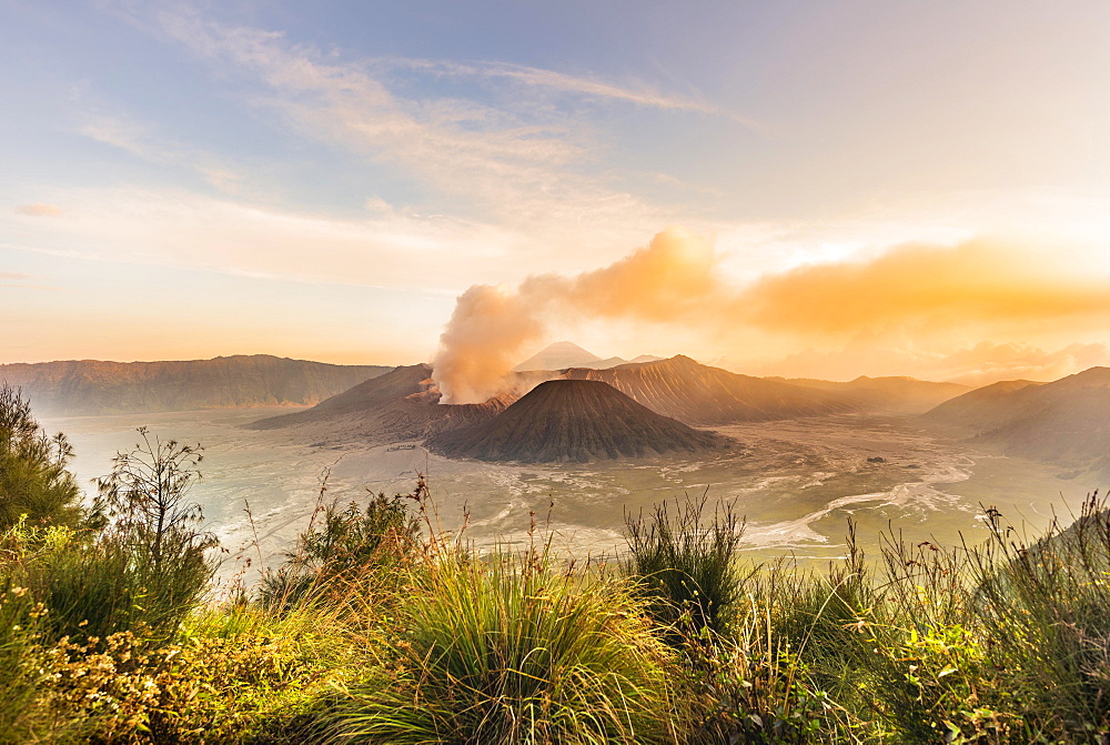 Sunrise, smoking volcano, Gunung Bromo, Mount Batok, Mount Kursi, Mount Semeru, Bromo Tengger Semeru National Park, Java, Indonesia, Asia