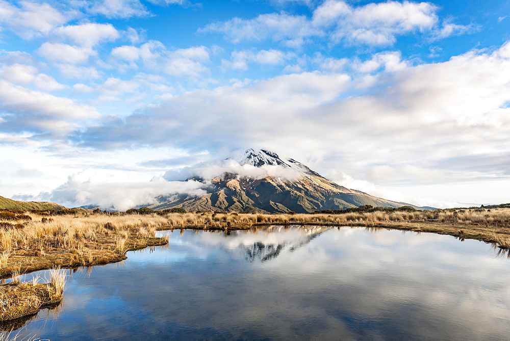 Reflection in Pouakai Tarn, stratovolcano Mount Taranaki or Mount Egmont, Egmont National Park, Taranaki, New Zealand, Oceania