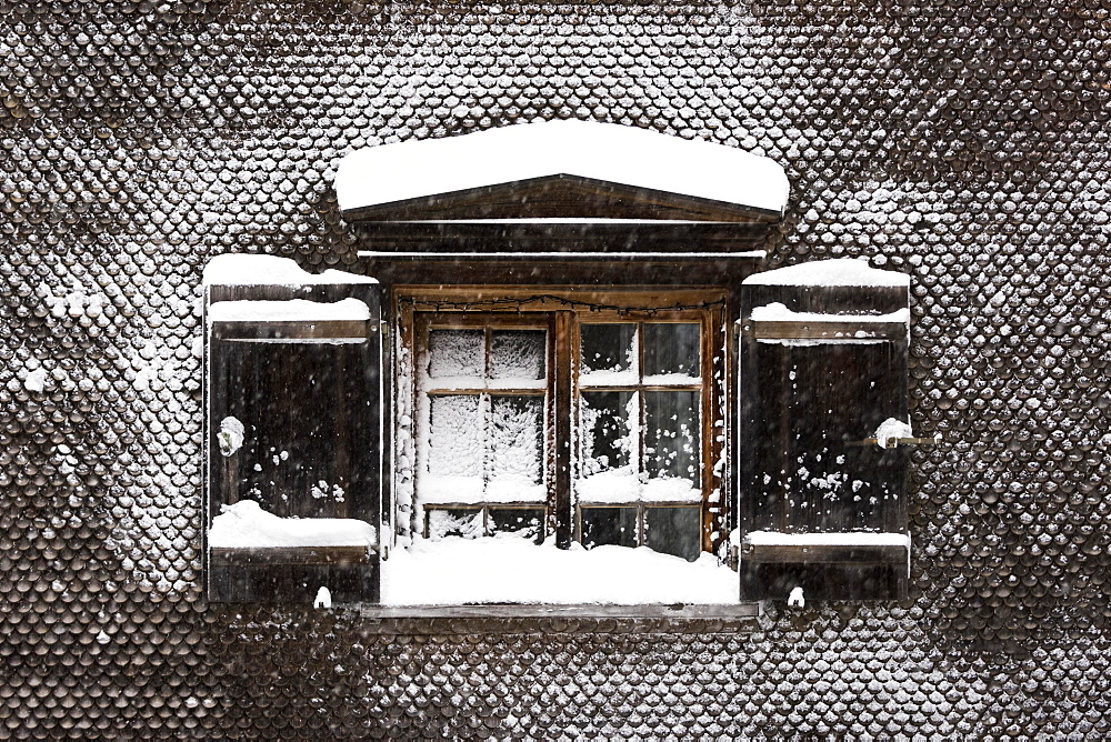 Snow-covered window on old farmhouse, Hittisau, Bregenz Forest, Vorarlberg, Austria, Europe