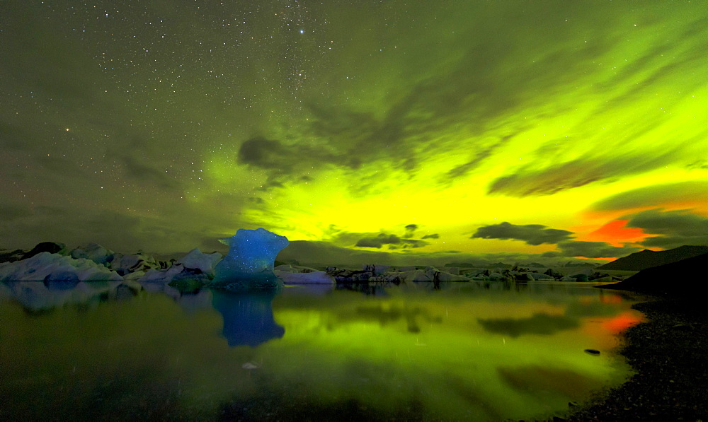 Blue iceberg in Aurora Borealis, Jökulsárlón, Hornafjörður, Austurland, Iceland, Europe