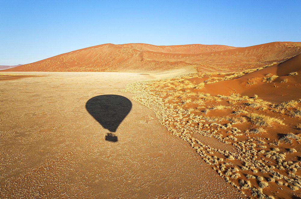 Shadow of a hot-air balloon in the Namib Desert, photographed from the basket of the balloon, Namib-Naukluft National Park, Namibia, Africa