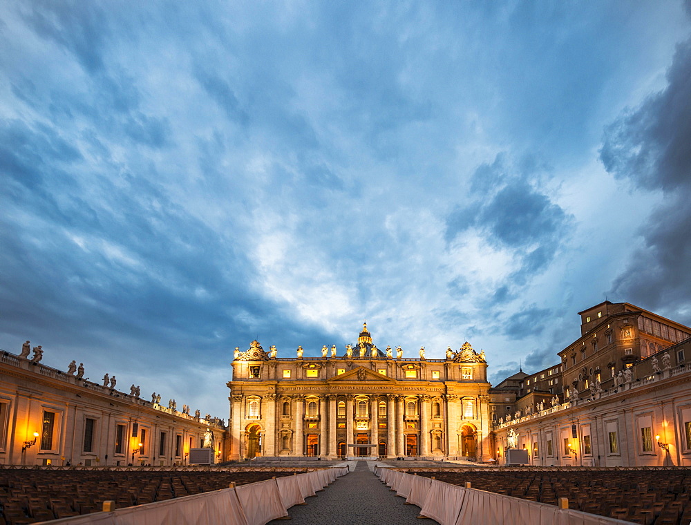 St. Peter's Square with St. Peter's Basilica and chairs for the papal audience, clouds, dusk, Vatican City, Rome, Italy, Europe