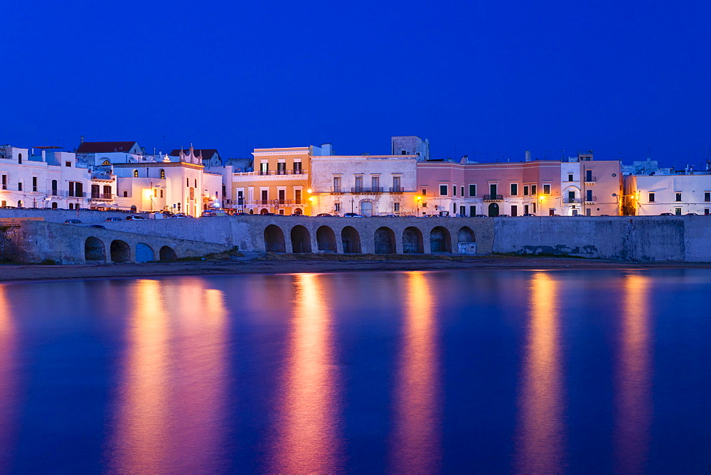 Blue hour, dusk, Seno della Purita city beach, historic centre with the church Chiesa della Purita, Gallipoli, Province of Lecce, Apulia, Italy, Europe