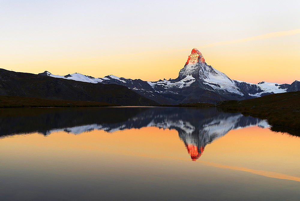 Matterhorn reflected in lake Stellisee, at sunrise, Valais Alps, Canton of Valais, Zermatt, Switzerland, Europe