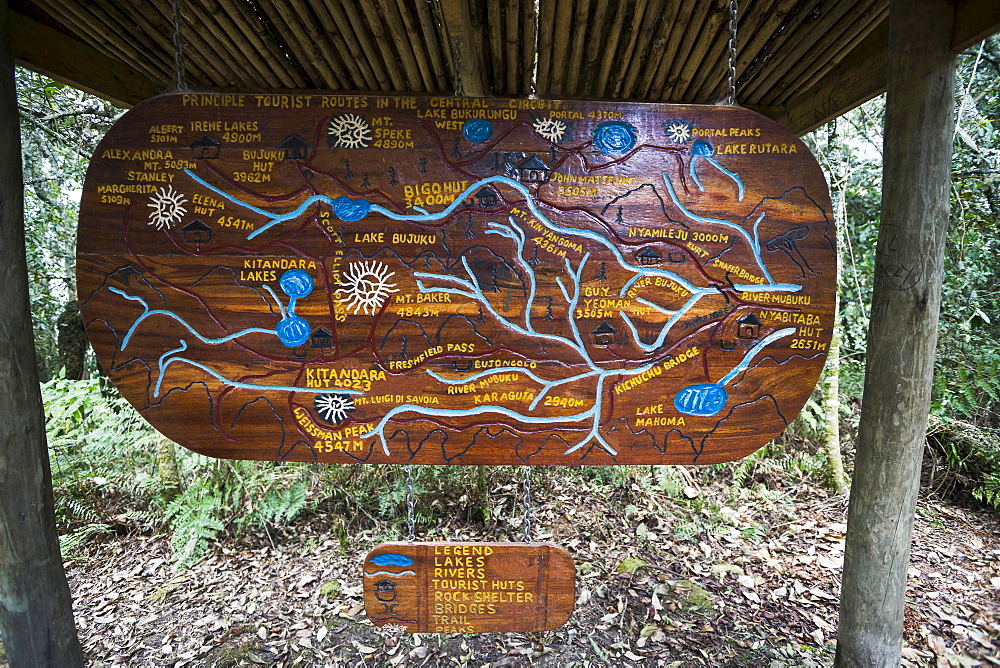 Wooden sign depicting hiking trails of the Central Circuit, Rwenzori Mountains, Uganda, Africa