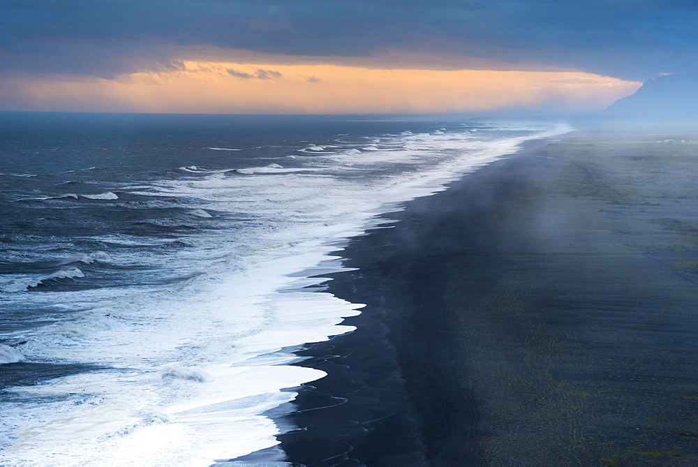 Dramatic clouds, black sandy beach near Dyrholaey, south coast, Southern Region, Iceland, Europe