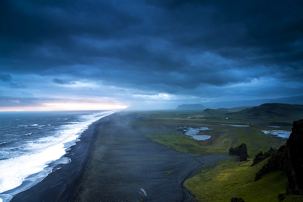 Dramatic clouds, black sandy beach near Dyrholaey, south coast, Southern Region, Iceland, Europe