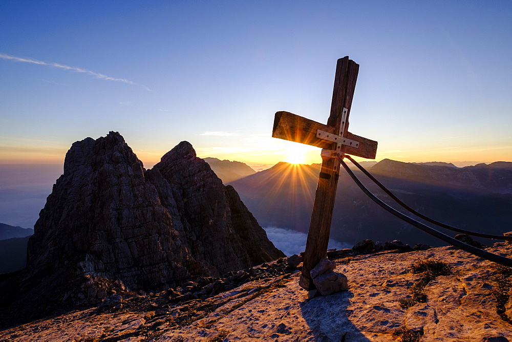 Summit cross of the third Watzmannkind in front of first and second Watzmannkind, sunrise, Watzmannkar, Watzmann, Berchtesgaden National Park, Berchtesgaden Alps, Schonau am Konigsee, Bavaria, Germany, Europe