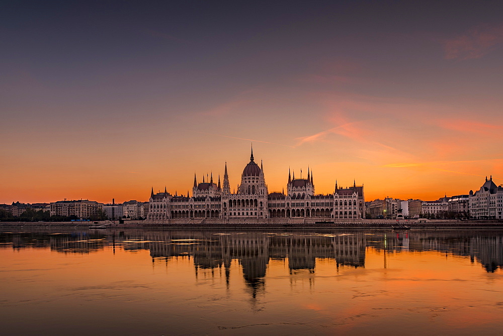 Sunrise with Parliament and water reflection in the Danube, Budapest, Hungary, Europe