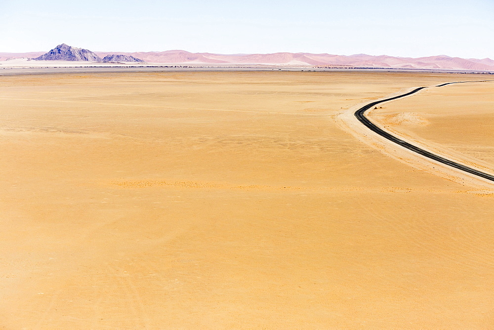 Aerial view, tarred road pulling you through desert landscape, Sossusvlei, Namib Desert, Namib-Naukluft National Park, Namibia, Africa