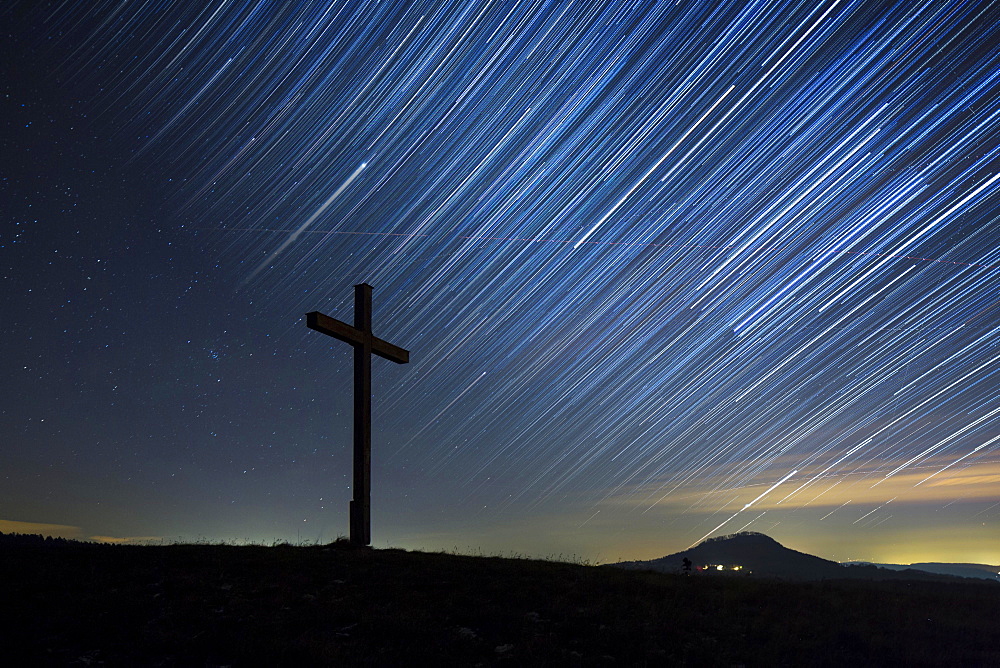 Summit cross on Bisberg Mountain with a starry sky, Hohenhewen Mountain at the back, Tengen, Watterdingen, Hegau, Baden-Wurttemberg, Germany, Europe