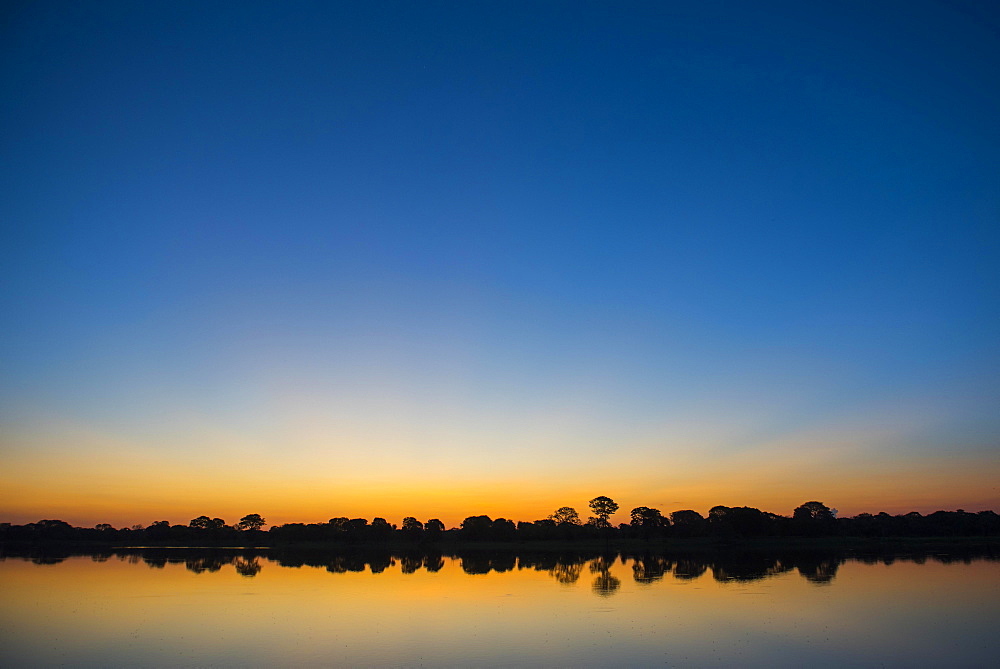 River landscape with Rio Negro at sunset, Fazenda Barranco Alto, Pantanal, Mato Grosso do Sul, Brazil, South America