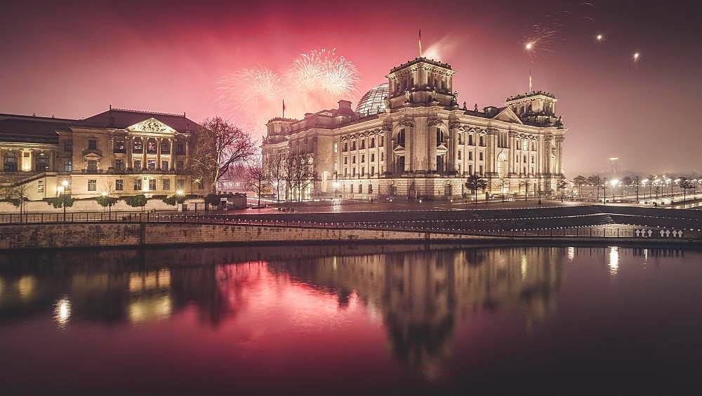 Reichstag bank with fireworks on New Year's Eve, Berlin, Germany, Europe