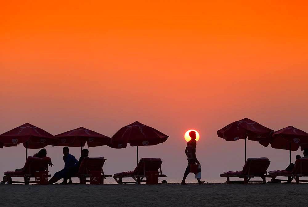 Silhouette of seller of tea on the beach in Cox's Bazar, Bangladesh, Asia