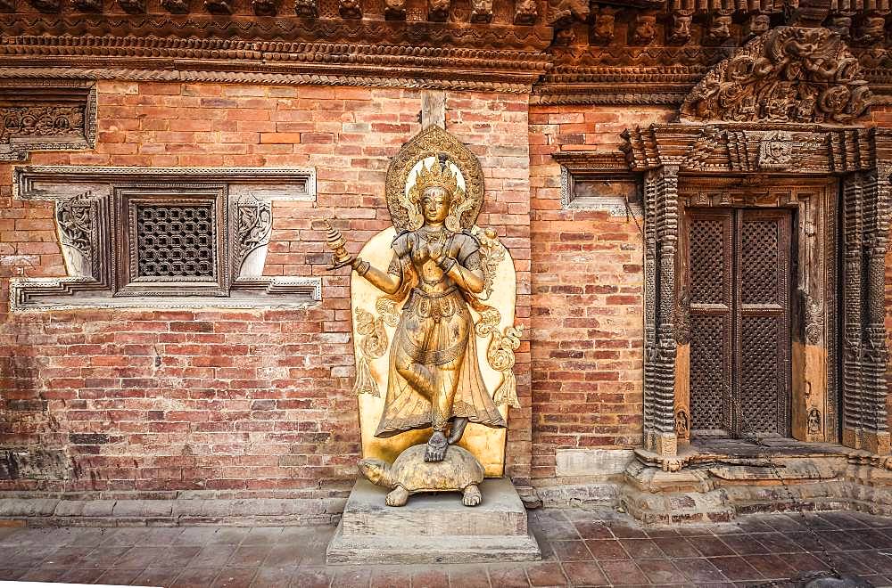 Buddhist deity, golden statue, temple, Patan, Kathmandu valley, Himalaya region, Nepal, Asia