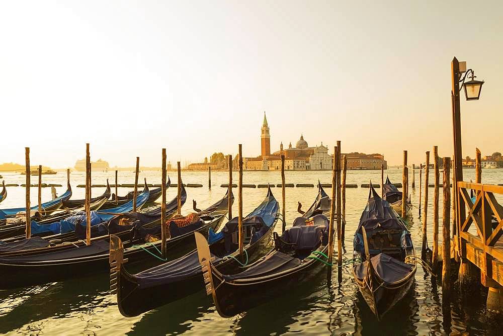 Gondolas in San Marco and Benedictine church of San Giorgio Maggiore on San Giorgio Maggiore island, Venice, Veneto, Italy, Europe