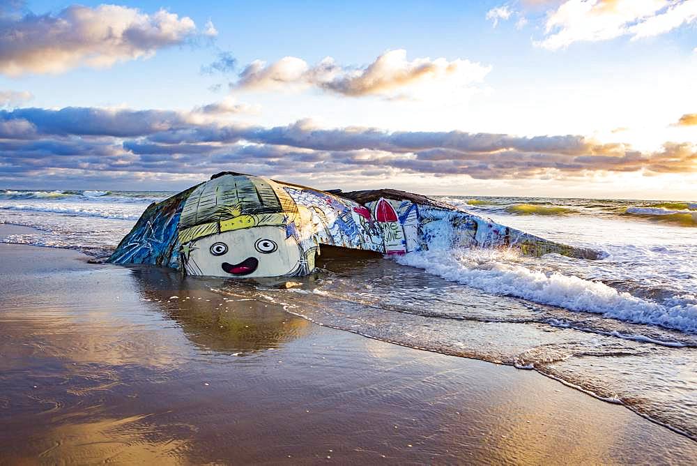 Colorfully painted bunker from the 2nd World War at high tide in the sea, Plage Gurp, Grayan-et-l`Hopital, Aquitaine, Gironde, France, Europe