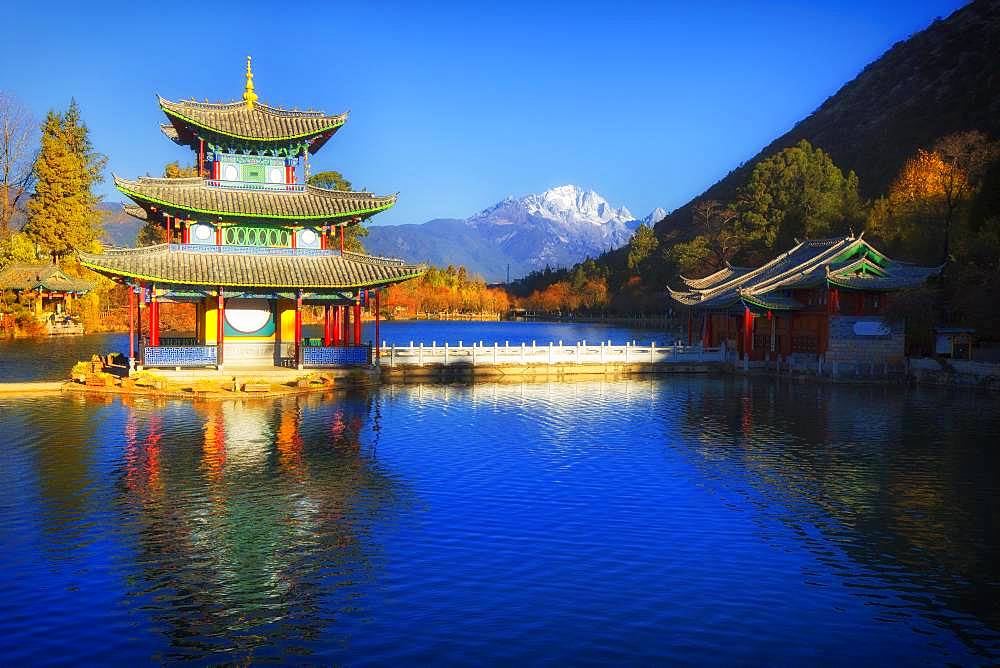 Chinese pagoda, Deyue Pavilion, reflected in Black Dragon Lake, Black Dragon Pool, in the background Jade Dragon Mountain, Unesco World Heritage Site, Lijiang, Yunnan Province, China, Asia