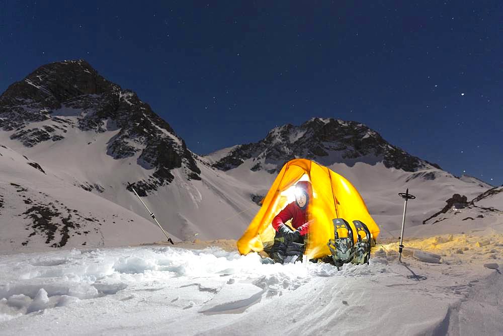 Snowshoe hikers in an illuminated tent in the snow on the Maedelejoch, night shot, near Kemptner Huette, Allgaeu Alps, Tyrol, Austria, Europe