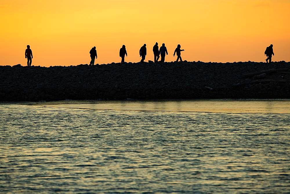 Backlit tourists, silhouette, sunset, Kobbefjord, Spitsbergen archipelago, Svalbard and Jan Mayen, Norway, Europe