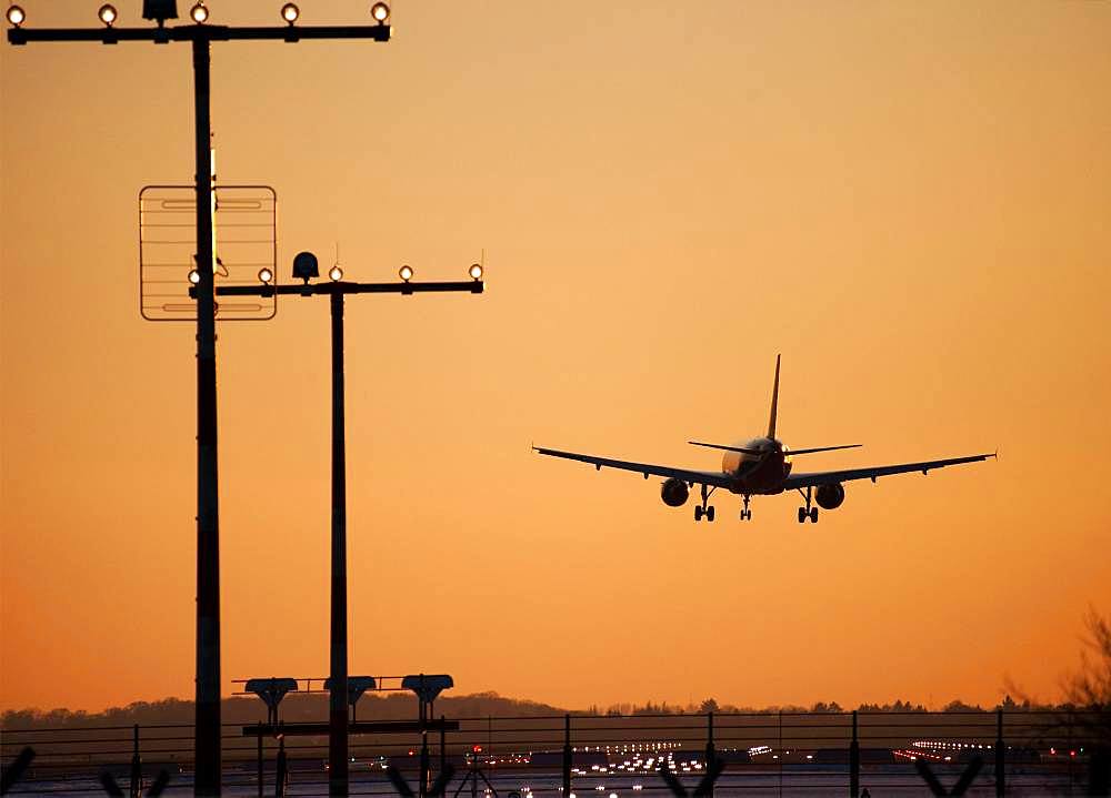 Approach aircraft at sunset, approach lighting, Duesseldorf Airport, Germany, Europe
