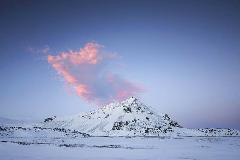 Snowy landscape, mountain with red cloud, south coast peninsula Snaefellsnes, Vesturland, Iceland, Europe