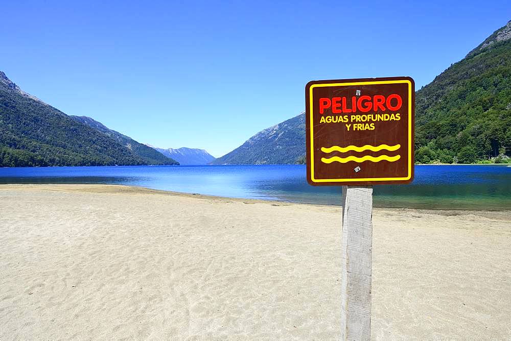 Sandy beach beach with warning sign, Attention deep and cold water, Lago Traful, Province Neuquen, Patagonia, Argentina, South America