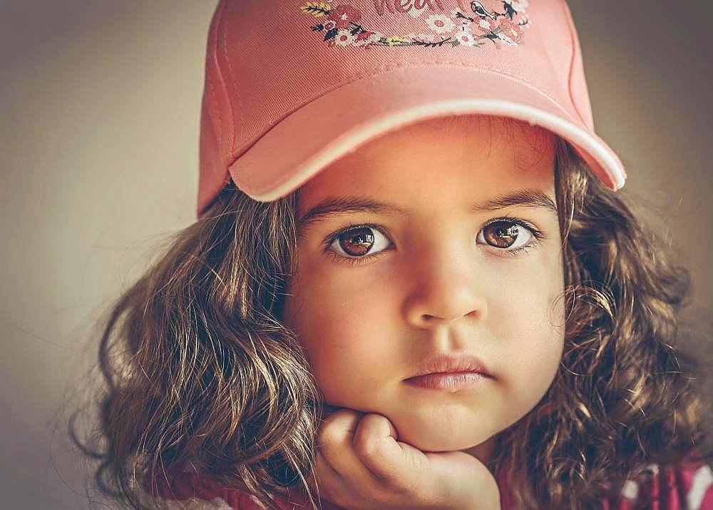 Girl, 3 years, portrait, direct view with peaked cap, Germany, Europe