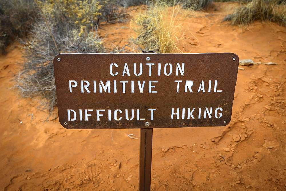 Caution Primitive Train, Difficult Hiking, sign with warning of unsecured trail, Devil's Garden Trail, Arches National Park, Utah, USA, North America