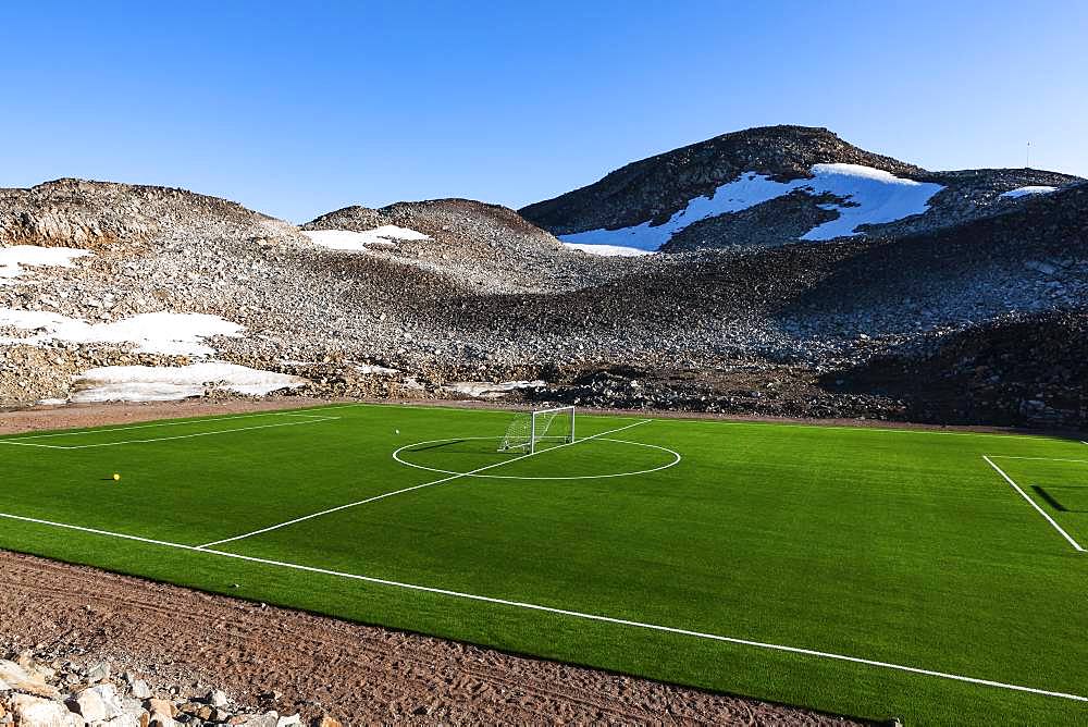 Football pitch with artificial turf, Ittoqqortoormiit, Scoresbysund, East Greenland, Greenland, North America