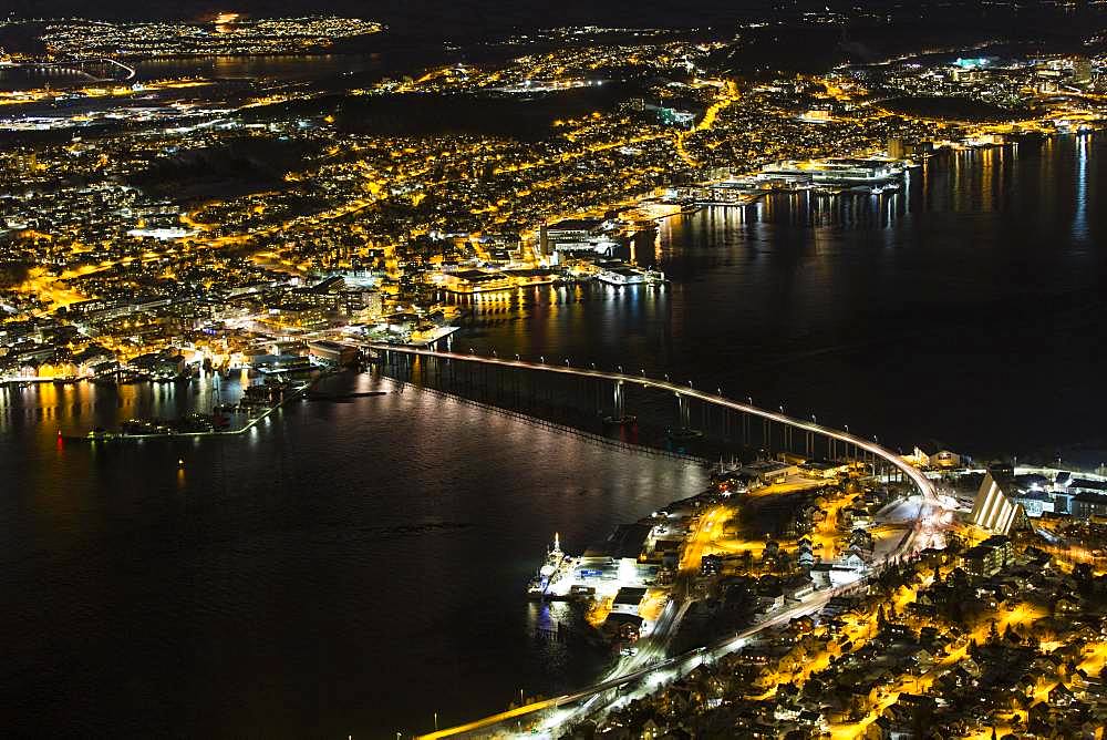 View from Fjellheisen to the Arctic Cathedral and the car bridge at night, Tromsoe, Norway, Europe