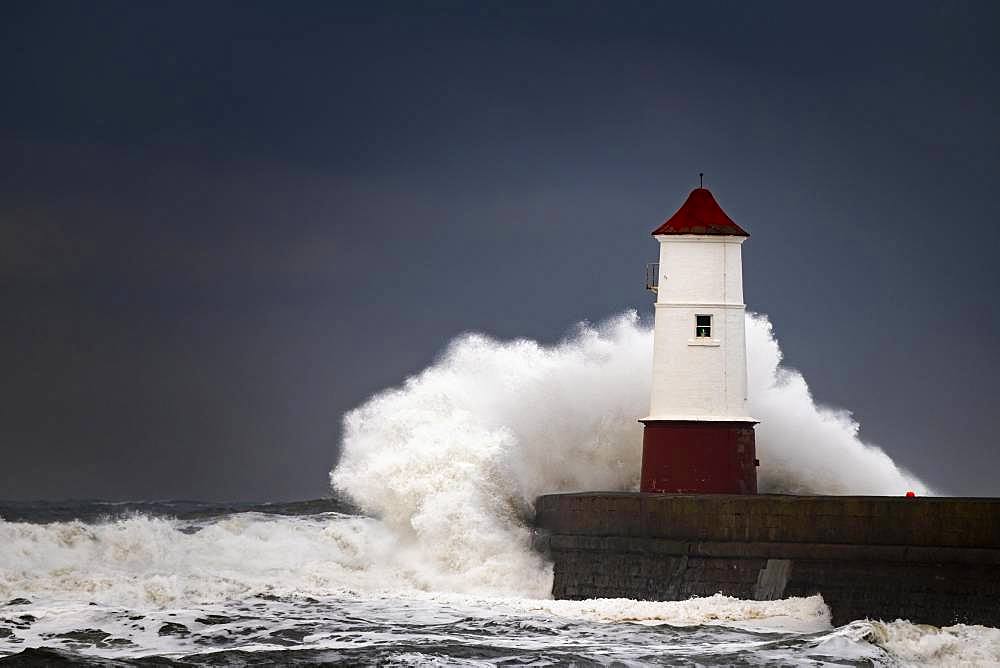 Berwick Lighthouse with strong surf and dark cloudy sky, Berwick-upon-Tweed, Newcastle upon Tyne, Northumberland, Great Britain