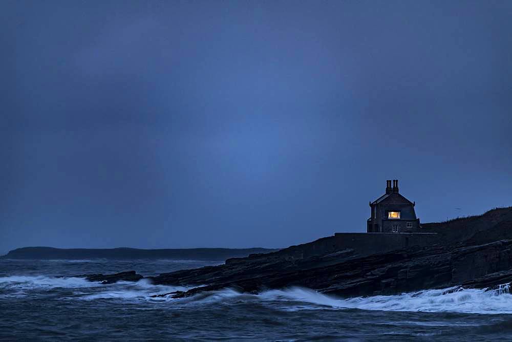 Small house on coast at blue hour, Berwick up on Tweed, Northumberland, Great Britain