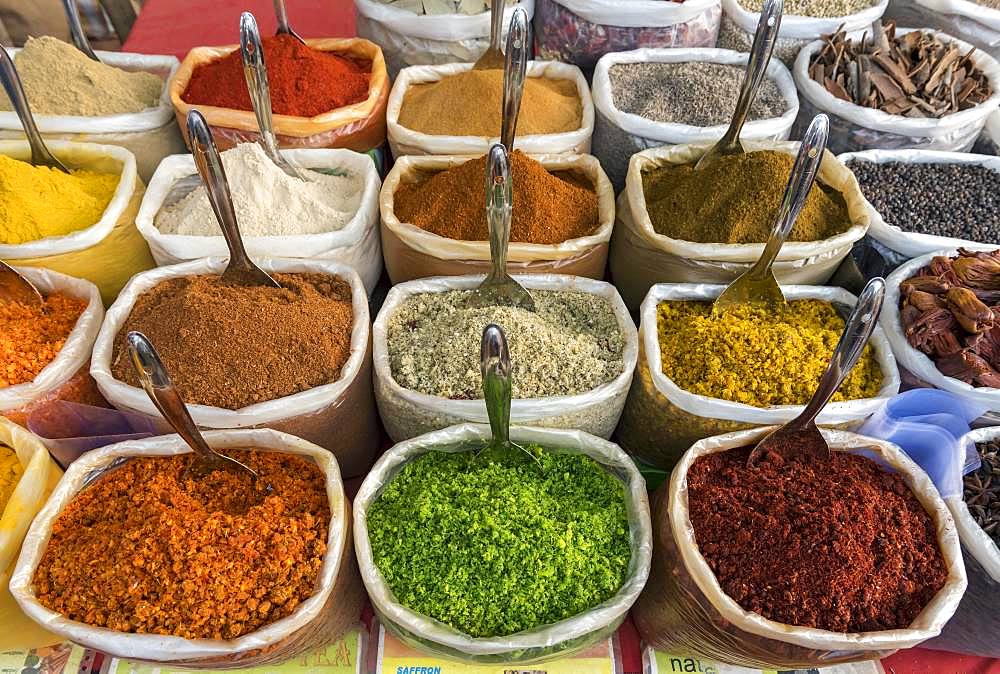 Spices, herbs and curry powders on display at Anjuna Beach Flea Market, Goa, India, Asia