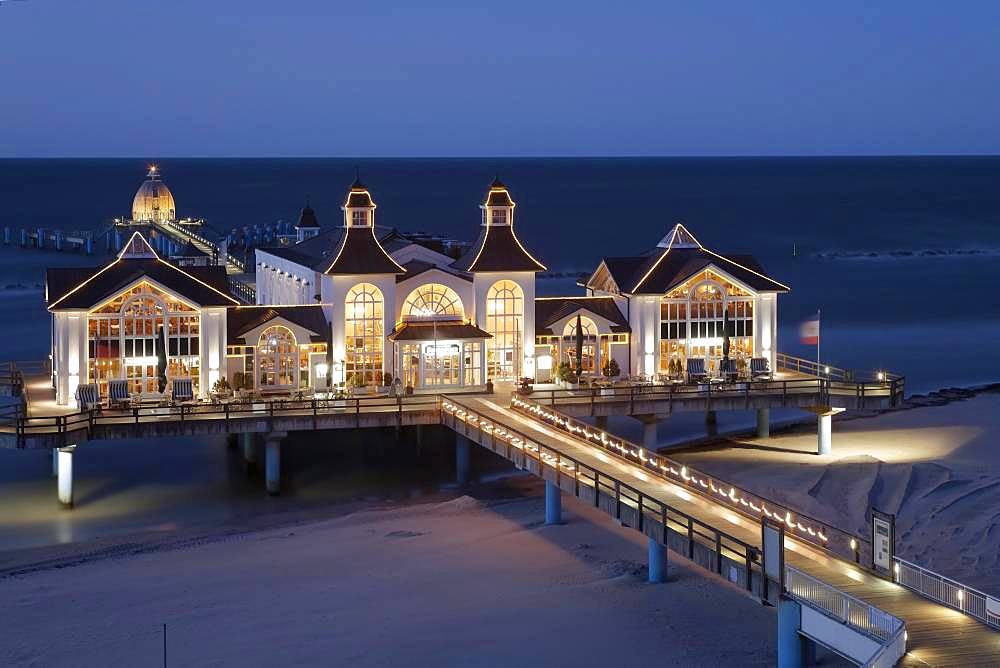 Illuminated pier at the Baltic Sea in evening mood, Sellin, Ruegen, Mecklenburg-Western Pomerania, Germany, Europe