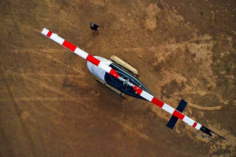 Aerial view, helicopter Bell Jet RANGER 206B for tourist flights on ground, at Wolwedans Dunes Lodge, NamibRand Nature Reserve, Namibia, Africa