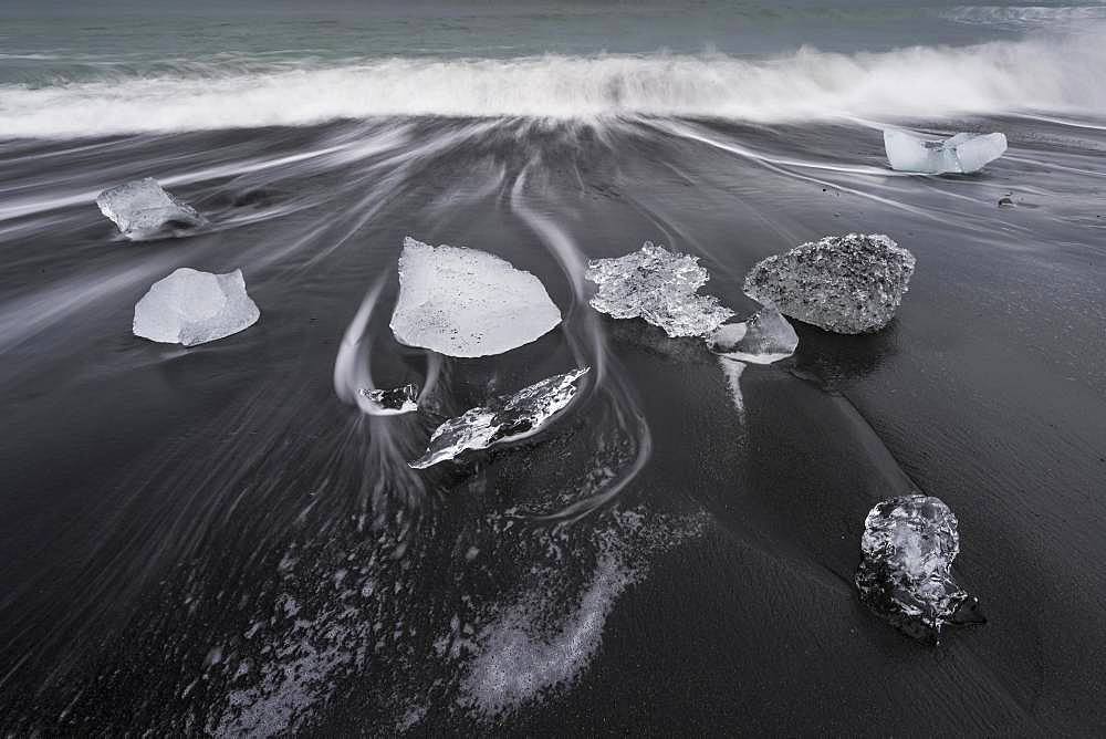 Surf and glacier ice on black beach, Joekulsarlon, South Iceland, Iceland, Europe