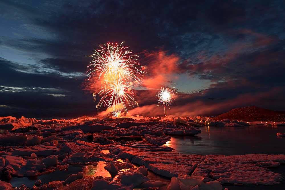 Annual fireworks over the glacier lagoon Joekulsarlon, South Iceland, Iceland, Europe