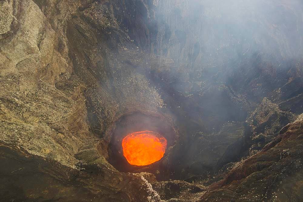 Glowing lava lake in the caldera of the Ambrym volcano, Ambrym Island, Vanuatu, Oceania