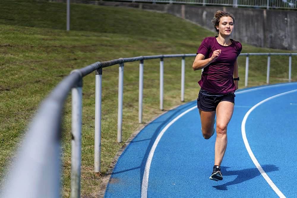 Athletics, woman sprinting in the curve, Germany, Europe