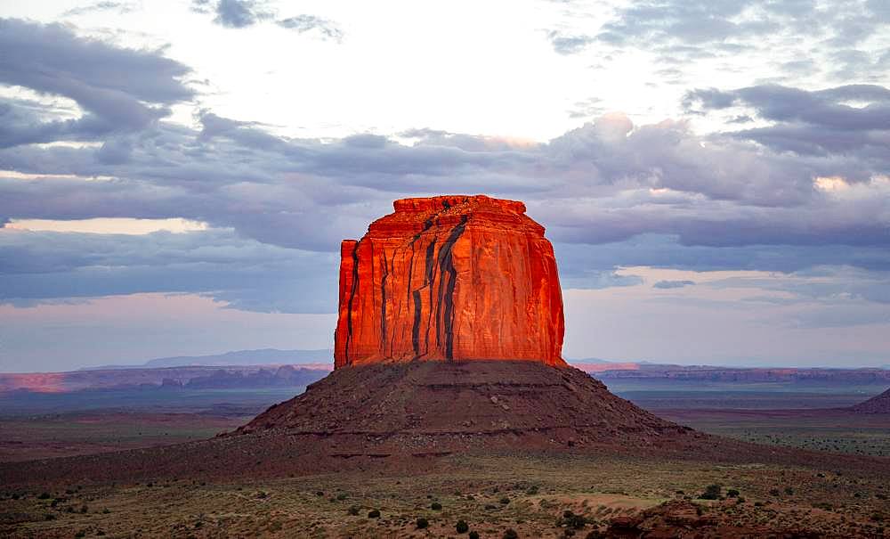 Table Mountain glows red at sunset, Merrick Butte, Navajo Tribal Park, Navajo Nation Reservation, Arizona, Utah, USA, North America